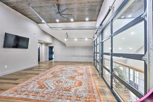 an empty room with a rug on the floor at Lavish Riverfront Escape with Gas Grill! in Glenwood