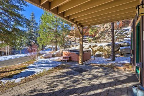 a porch of a house with a tub in the snow at Ski-InandSki-Out Donnelly Townhome with Hot Tub! in Donnelly