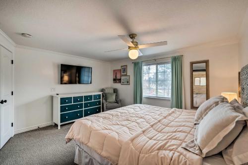 a bedroom with a bed and a ceiling fan at Spacious Layton Retreat with Private Hot Tub! in Layton