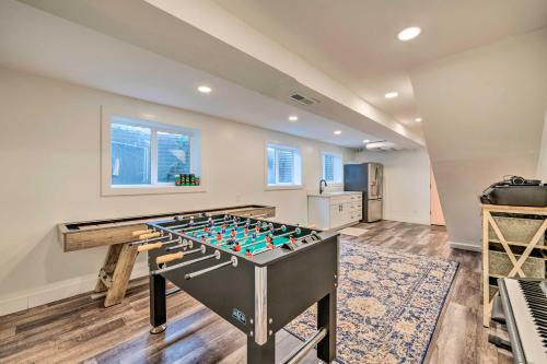 a game room with a foosball table and a piano at Spacious Layton Retreat with Private Hot Tub! in Layton
