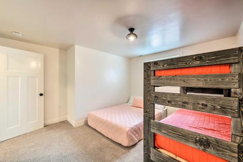 a bedroom with a bunk bed in a room at Spacious Layton Retreat with Private Hot Tub! in Layton