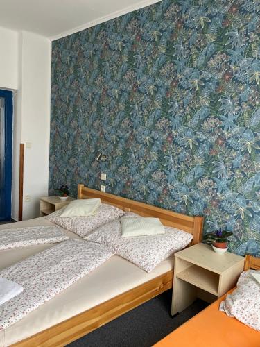 Postel nebo postele na pokoji v ubytování Penzion Slunečnice