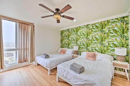 a bedroom with two beds and a large window at Beachfront Oceanside Condo with Amenity Access! in Oceanside