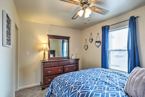 a bedroom with a bed and a dresser and a mirror at Cozy Helper Home with Fenced Yard, Pets Welcome in Helper