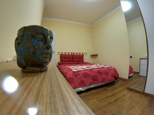 a bedroom with a bed and a large mirror at La Dimora del Piccolo Buddha in Rapallo