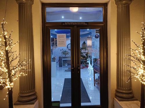 a door in a store with christmas lights at Torbay Court Hotel in Paignton