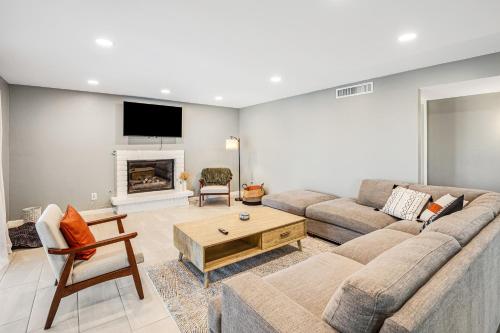 a living room with a couch and a fireplace at Cathay Place in Tucson