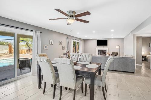 a dining room and living room with a table and chairs at Cathay Place in Tucson
