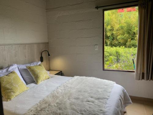 Postel nebo postele na pokoji v ubytování Ecolodge Bahia del Peñón