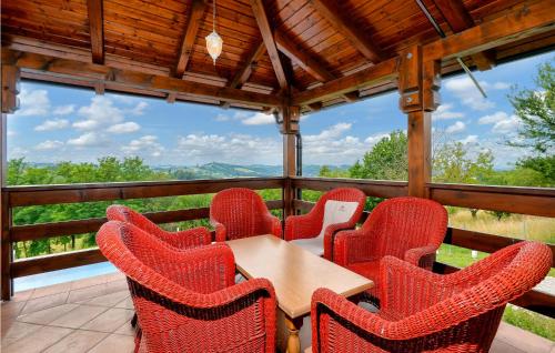 a table and chairs on a balcony with a view at Nice Home In Zelezna Gora With Sauna in Grabrovnik