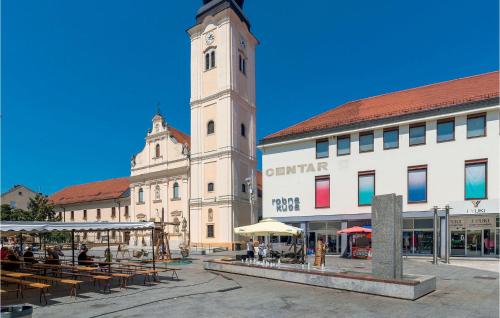 a large building with a clock tower in a city at Nice Home In Zelezna Gora With Sauna in Grabrovnik