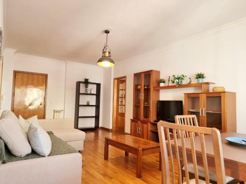 a living room with a couch and a table at Down Town Apartment - EXPO27 in Lisbon