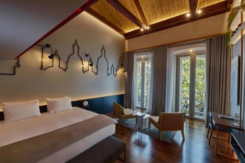 Ein Bett oder Betten in einem Zimmer der Unterkunft Casa Firenza Hotel & Suites Boutique
