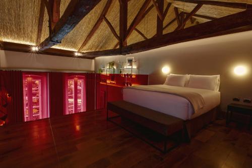 Ein Bett oder Betten in einem Zimmer der Unterkunft Casa Firenza Hotel & Suites Boutique