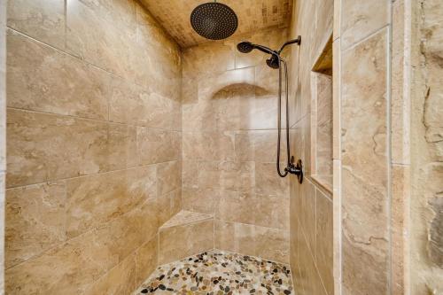 a bathroom with a shower with a glass door at Cabina di Christina in Dahlonega