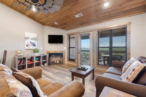 a living room with a couch and a fireplace at Table Rock Resorts at Indian Point in Branson