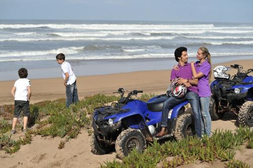 a group of people on atvs on the beach at Pullman Mazagan Royal Golf & Spa in El Jadida