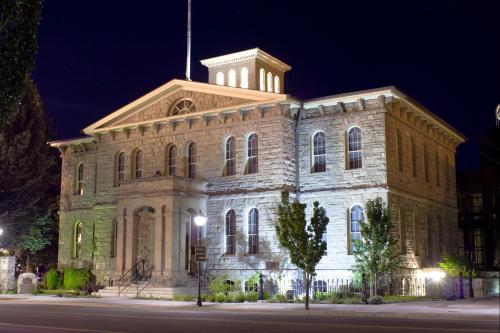 a large stone building with a tower at night at Gold Dust West in Carson City