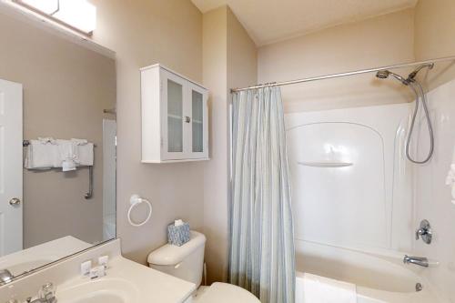 a bathroom with a sink and a toilet and a shower at Costa Del Ray in North Myrtle Beach