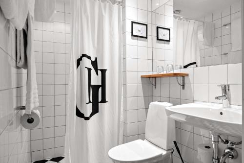 Koupelna v ubytování Best Western Plus Grand Hotel