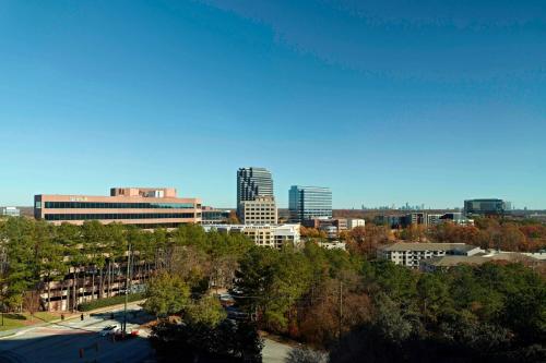 a view of a city with tall buildings and trees at Sonesta Select Atlanta Cumberland Galleria Ballpark in Atlanta