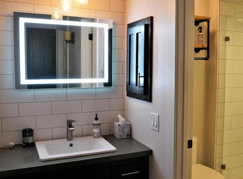 a bathroom with a sink and a mirror at Golf Club Condos #437 in Truckee
