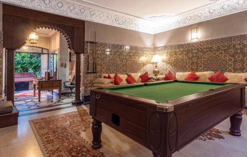 a living room with a pool table in it at Villa Soraya Hammam & Jacuzzi in Marrakesh