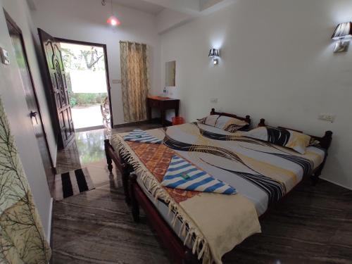 Ένα ή περισσότερα κρεβάτια σε δωμάτιο στο Marari brezza homestay