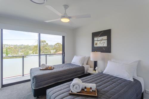 Ένα ή περισσότερα κρεβάτια σε δωμάτιο στο Chapel Heights Apartments