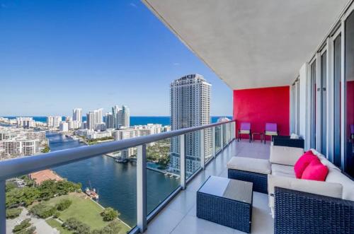 a balcony with a view of the water at Stunning Penthouse Suite Waterfront 2BD 2BA in Hallandale Beach