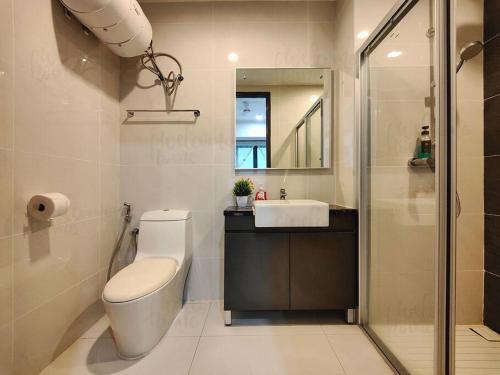a bathroom with a toilet and a sink and a shower at Royal Strand, Country Garden Danga Bay Homestay by WELCOME HOME in Johor Bahru