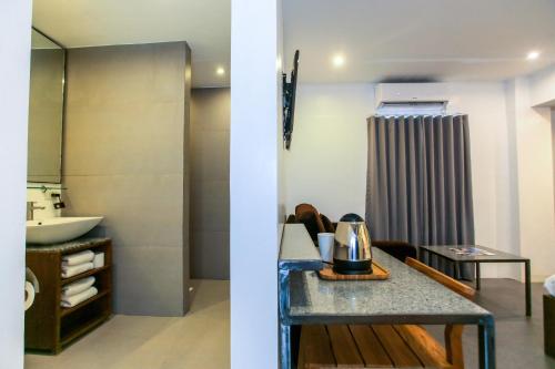 a bathroom with a counter and a sink in a room at Hotel Durban in Manila