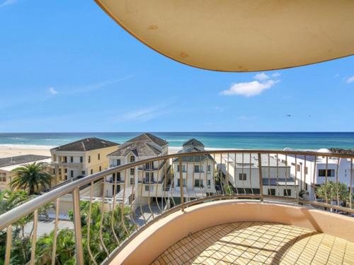 a balcony with a view of the beach and the ocean at Seascape - Hosted by Burleigh Letting in Gold Coast