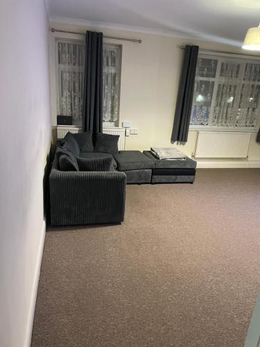 a living room with two couches and a couch at Welcome to your new home. in Redbridge
