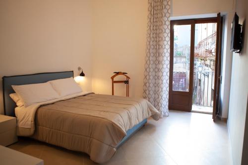 Postel nebo postele na pokoji v ubytování CasaPaola b&b Rooms