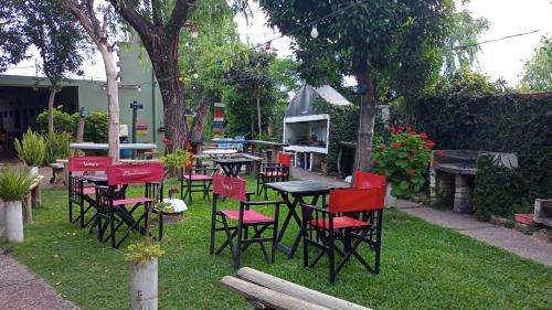 a group of tables and chairs in a yard at Bungalows Maneyros in Gualeguaychú
