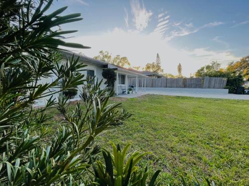 a house with a lawn in front of it at 4 miles to Siesta Key Beach #1 in America in Sarasota