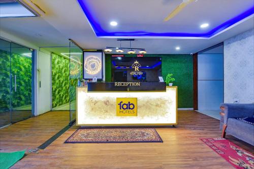a lobby with a reception desk in a building at FabHotel Royal King in Ahmedabad