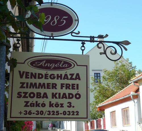 a sign for a restaurant on the side of a building at Angéla Vendegház in Tokaj