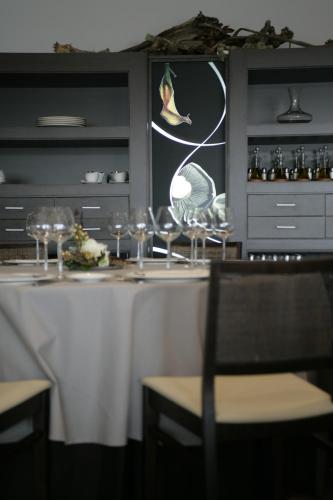 a table with wine glasses on top of it at Hotel Europa in Utebo