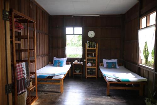 Postel nebo postele na pokoji v ubytování Bann Chi Homestay