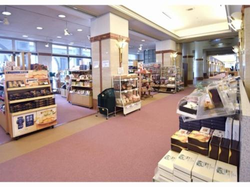 a store aisle with a lot of products on display at Kobe Hotel Fruit Flower in Kobe