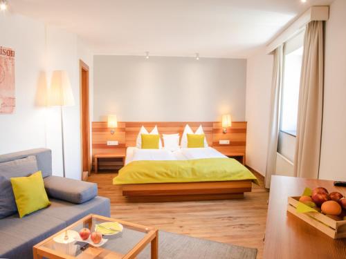 Säng eller sängar i ett rum på Berghotel Malta