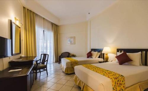 Katil atau katil-katil dalam bilik di The Orient Star Resort Lumut