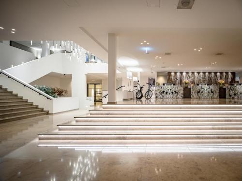 a staircase in a building with a lobby at Van der Valk Hotel Heerlen in Heerlen