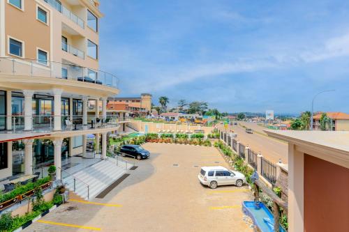 a view of a parking lot in front of a building at Hotel Horizon Entebbe in Entebbe