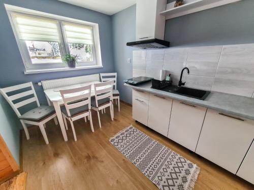 Kuchyň nebo kuchyňský kout v ubytování Apartament Za Potokiem