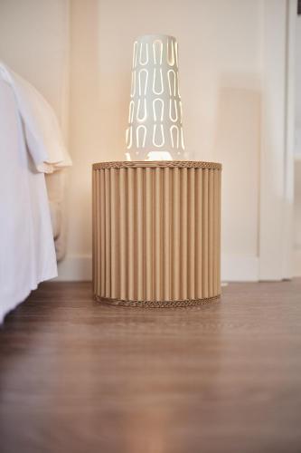 a table with a light on it in a room at Borgo della Spiga - Adult Friendly Country House in Cervidone