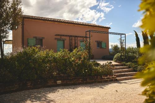 a small house with stairs leading up to it at Borgo della Spiga - Adult Friendly Country House in Cervidone