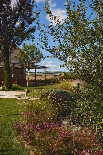 a garden with a gazebo in the background at Borgo della Spiga - Adult Friendly Country House in Cervidone